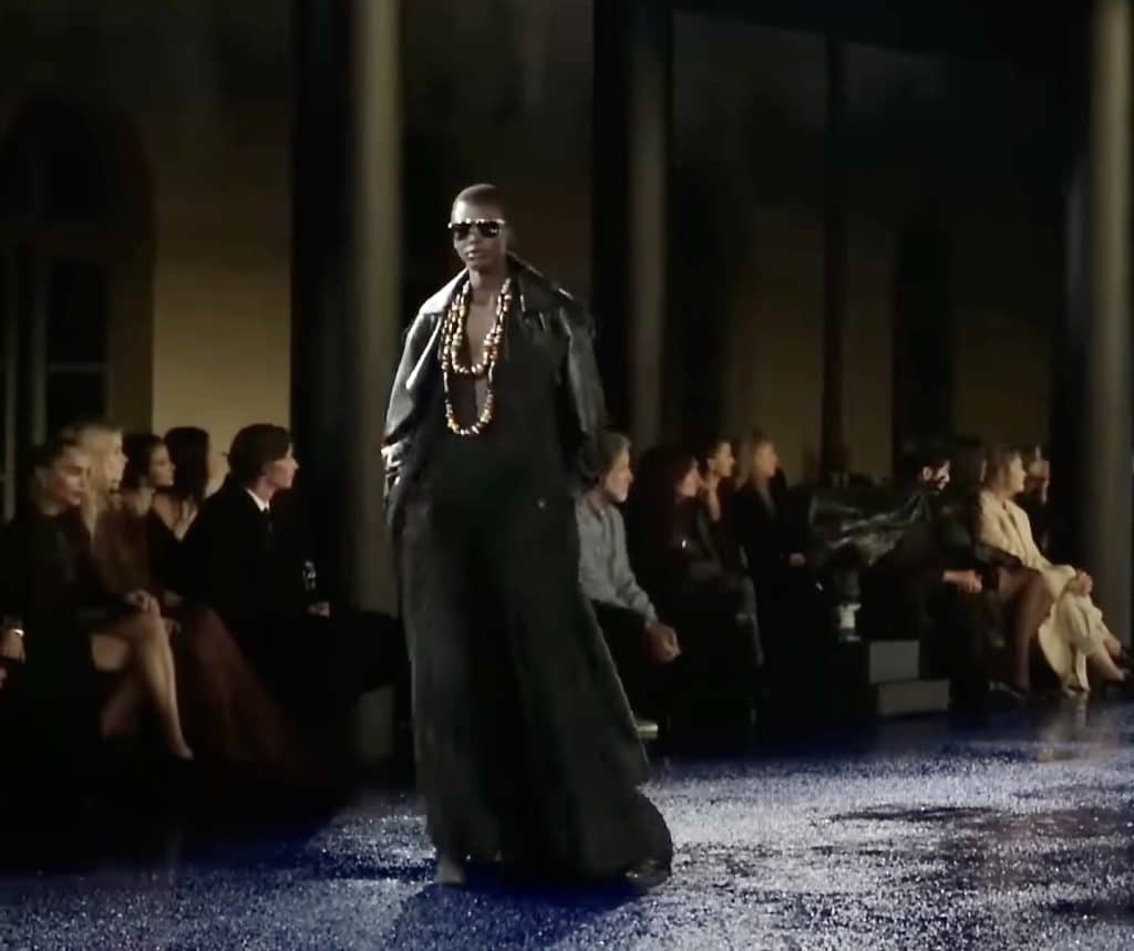 woman at Paris fashion week 2024 wearing all black outfit including leather jacket and long skirt